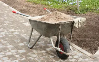 A picture of a wheelbarrow full of sand - How Much Sand Does A Wheelbarrow Hold (How Much Does It Weigh)