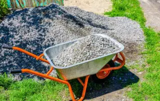 A wheelbarrow full of rocks - how many wheelbarrows are in a ton or cubic meter