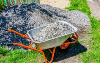 A wheelbarrow full of rocks - how many wheelbarrows are in a ton or cubic meter