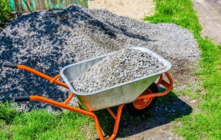 A wheelbarrow full of rocks - how many wheelbarrows are in a ton or cubic meter